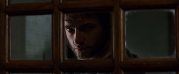 Movie still from “X-Men” (2000), directed by Bryan Singer – A person looking into a mirror; Close Up shot, Over the shoulder angle