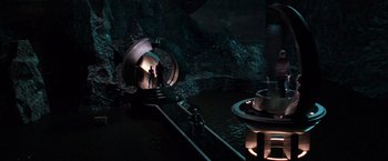 Movie still from “X-Men” (2000), directed by Bryan Singer – A man standing in front of an entrance to a cave; Extreme Wide shot, High angle