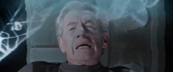 Movie still from “X-Men” (2000), directed by Bryan Singer – An older man with a frowning expression; Close Up shot, High angle