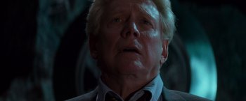 Movie still from “X-Men” (2000), directed by Bryan Singer – An older man with blonde spiky hair looking up at the sky; Close Up shot, Low angle
