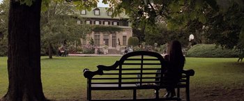Movie still from “X-Men” (2000), directed by Bryan Singer – A park bench sitting in the middle of a lawn; Extreme Wide shot, High angle
