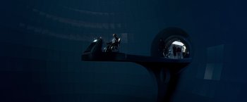 Movie still from “X-Men” (2000), directed by Bryan Singer – A man sitting on top of a car in the middle of the night; Wide shot, High angle