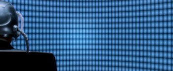 Movie still from “X-Men” (2000), directed by Bryan Singer – A person standing in front of a wall of blue lights; Extreme Close Up shot, Low angle