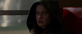 Movie still from “X-Men” (2000), directed by Bryan Singer – A woman wearing a hooded sweatshirt looking at the camera; Close Up shot, Low angle