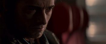 Movie still from “X-Men” (2000), directed by Bryan Singer – A man's face in the dark; Close Up shot, Over the shoulder angle