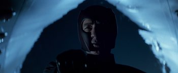 Movie still from “X-Men” (2000), directed by Bryan Singer – A man wearing a helmet and gloves in the dark; Close Up shot, Low angle