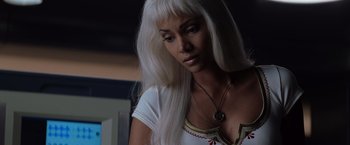 Movie still from “X-Men” (2000), directed by Bryan Singer – A woman with long white hair looking down; Close Up shot, High angle