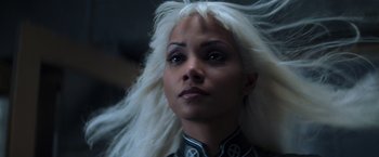 Movie still from “X-Men” (2000), directed by Bryan Singer – A person with long white hair; Close Up shot, Low angle