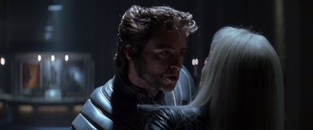 Movie still from “X-Men” (2000), directed by Bryan Singer – A person wearing a costume; Close Up shot, Over the shoulder angle