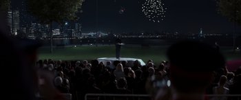 Movie still from “X-Men” (2000), directed by Bryan Singer – A crowd of people watching fireworks at night; Extreme Wide shot, Over the shoulder angle