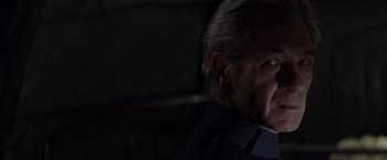 Movie still from “X-Men” (2000), directed by Bryan Singer – An older man is looking into the distance; Close Up shot, Over the shoulder angle