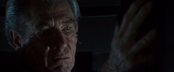 Movie still from “X-Men” (2000), directed by Bryan Singer – An older man with a beard looking at the camera; Close Up shot, Over the shoulder angle