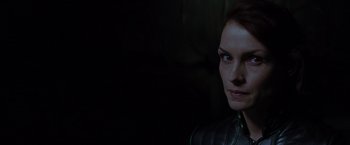 Movie still from “X-Men” (2000), directed by Bryan Singer – A woman's face in the dark; Close Up shot, Over the shoulder angle