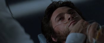 Movie still from “X-Men” (2000), directed by Bryan Singer – A person with a face mask on; Close Up shot, Low angle