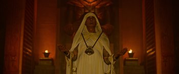 Movie still from “X-Men: Apocalypse” (2016), directed by Bryan Singer – An old man dressed as a monk in a white robe; Medium shot, Low angle