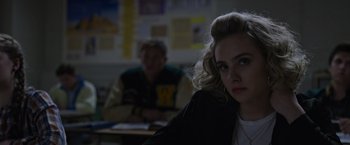 Movie still from “X-Men: Apocalypse” (2016), directed by Bryan Singer – A woman sitting in front of a man in a room; Close Up shot, Over the shoulder angle