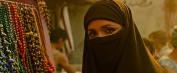 Movie still from “X-Men: Apocalypse” (2016), directed by Bryan Singer – A person wearing a veil; Close Up shot, Over the shoulder angle