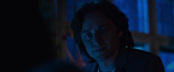 Movie still from “X-Men: Apocalypse” (2016), directed by Bryan Singer – A person with long dark hair; Close Up shot, Over the shoulder angle