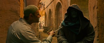 Movie still from “X-Men: Apocalypse” (2016), directed by Bryan Singer – A man is holding a knife in his hand and another man is holding a knife in his hand; Medium shot, Over the shoulder angle