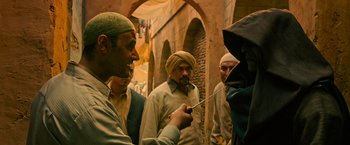 Movie still from “X-Men: Apocalypse” (2016), directed by Bryan Singer – A group of men standing next to each other; Medium shot, Over the shoulder angle