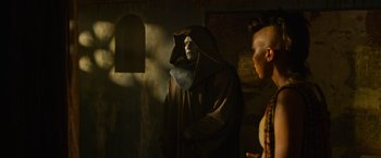 Movie still from “X-Men: Apocalypse” (2016), directed by Bryan Singer – A man in a hooded robe and a man in a hooded robe; Medium shot, Over the shoulder angle