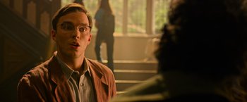 Movie still from “X-Men: Apocalypse” (2016), directed by Bryan Singer – A young man with glasses is looking at a camera; Close Up shot, Over the shoulder angle