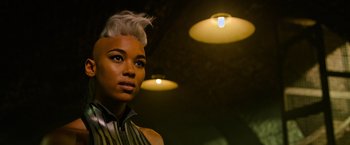 Movie still from “X-Men: Apocalypse” (2016), directed by Bryan Singer – A woman with white hair is posing for a picture; Close Up shot, Low angle
