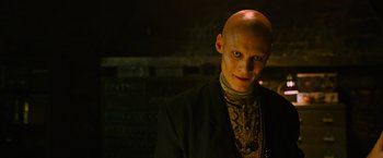 Movie still from “X-Men: Apocalypse” (2016), directed by Bryan Singer – A man with bald head wearing a black suit; Close Up shot, Low angle