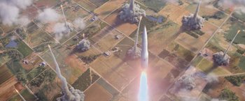 Movie still from “X-Men: Apocalypse” (2016), directed by Bryan Singer – An aerial view of a space shuttle launching; Extreme Wide shot, Overhead angle