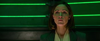 Movie still from “X-Men: Apocalypse” (2016), directed by Bryan Singer – A woman in a suit looking at the camera; Close Up shot, Low angle