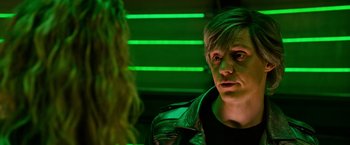Movie still from “X-Men: Apocalypse” (2016), directed by Bryan Singer – A man and a woman in a green lit room; Close Up shot, Over the shoulder angle