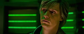 Movie still from “X-Men: Apocalypse” (2016), directed by Bryan Singer – A person with green lights in the background; Close Up shot, High angle