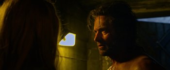 Movie still from “X-Men: Apocalypse” (2016), directed by Bryan Singer – A person with long dark hair; Close Up shot, Over the shoulder angle