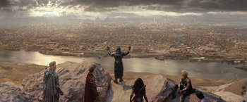 Movie still from “X-Men: Apocalypse” (2016), directed by Bryan Singer – A man standing on top of a mountain near two other people; Extreme Wide shot, High angle