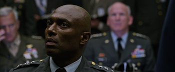 Movie still from “X-Men: Apocalypse” (2016), directed by Bryan Singer – A person wearing a military uniform; Close Up shot, Low angle