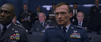 Movie still from “X-Men: Apocalypse” (2016), directed by Bryan Singer – A man in a military uniform is looking at the camera; Close Up shot, Low angle