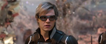 Movie still from “X-Men: Apocalypse” (2016), directed by Bryan Singer – A man wearing sunglasses looking at the camera; Close Up shot, Over the shoulder angle