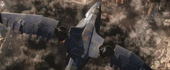 Movie still from “X-Men: Apocalypse” (2016), directed by Bryan Singer – An aerial view of a fighter jet flying through the clouds; Extreme Wide shot, Overhead angle