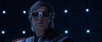 Movie still from “X-Men: Apocalypse” (2016), directed by Bryan Singer – A man wearing goggles standing in front of some lights; Close Up shot, Low angle