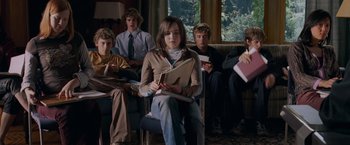 Movie still from “X-Men: The Last Stand” (2006), directed by Brett Ratner – A group of young people sitting in a room; Medium shot, High angle