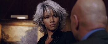 Movie still from “X-Men: The Last Stand” (2006), directed by Brett Ratner – A person wearing a black shirt; Close Up shot, Over the shoulder angle