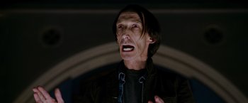 Movie still from “X-Men: The Last Stand” (2006), directed by Brett Ratner – An older man with long black hair and a black shirt; Close Up shot, Low angle