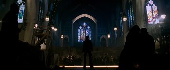 Movie still from “X-Men: The Last Stand” (2006), directed by Brett Ratner – A man standing in front of a stained - glass window; Wide shot, Low angle