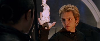 Movie still from “X-Men: The Last Stand” (2006), directed by Brett Ratner – A young man holding out his hand with fire coming out of it; Close Up shot, Over the shoulder angle