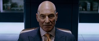 Movie still from “X-Men: The Last Stand” (2006), directed by Brett Ratner – A bald man in a suit and a tie; Close Up shot, Low angle