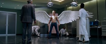 Movie still from “X-Men: The Last Stand” (2006), directed by Brett Ratner – A man that has wings on his body; Medium shot, Low angle