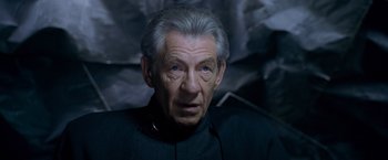 Movie still from “X-Men: The Last Stand” (2006), directed by Brett Ratner – An older man wearing a black shirt and a white beard; Close Up shot, Low angle