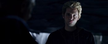 Movie still from “X-Men: The Last Stand” (2006), directed by Brett Ratner – A young man with blonde hair is looking at the camera; Close Up shot, Over the shoulder angle