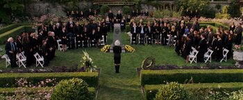 Movie still from “X-Men: The Last Stand” (2006), directed by Brett Ratner – A woman standing in front of a group of people in a cemetery; Wide shot, High angle