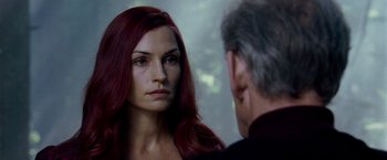 Movie still from “X-Men: The Last Stand” (2006), directed by Brett Ratner – A woman with long red hair looking at a man with gray hair; Close Up shot, Over the shoulder angle